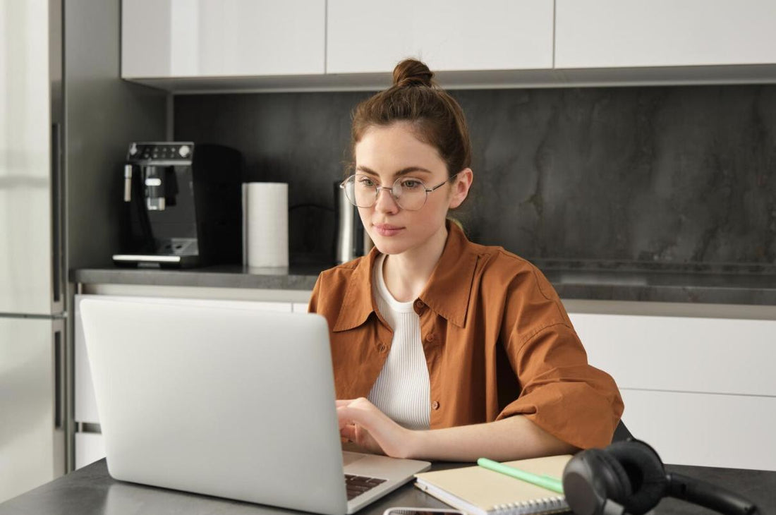 A student studying for the NREMT exam on their laptop