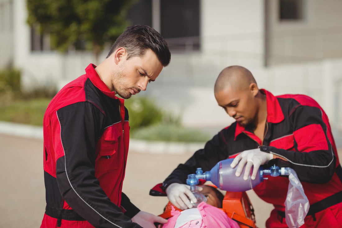 EMT paramedic providing oxygen support to an injured child during emergency response