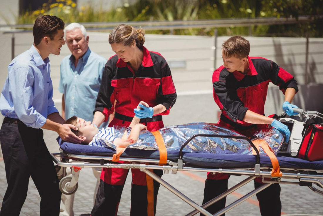 EMS paramedics providing care and assessment to an injured child during an emergency situation
