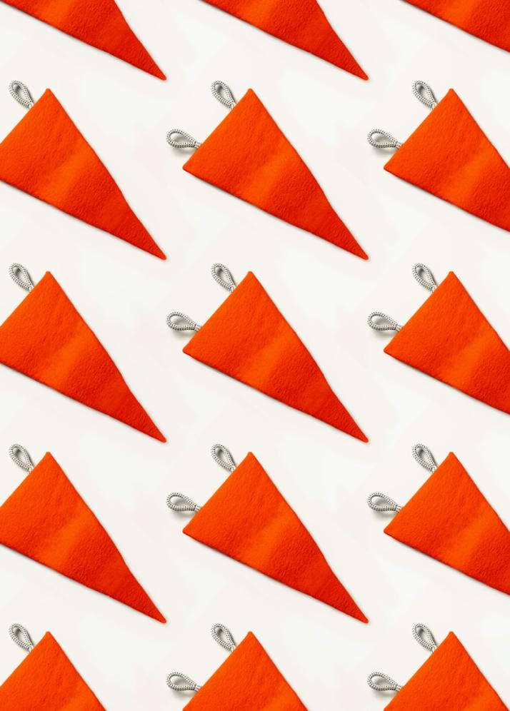 Close-up of orange triangular icons representing warning signs or red flags in medical scenarios