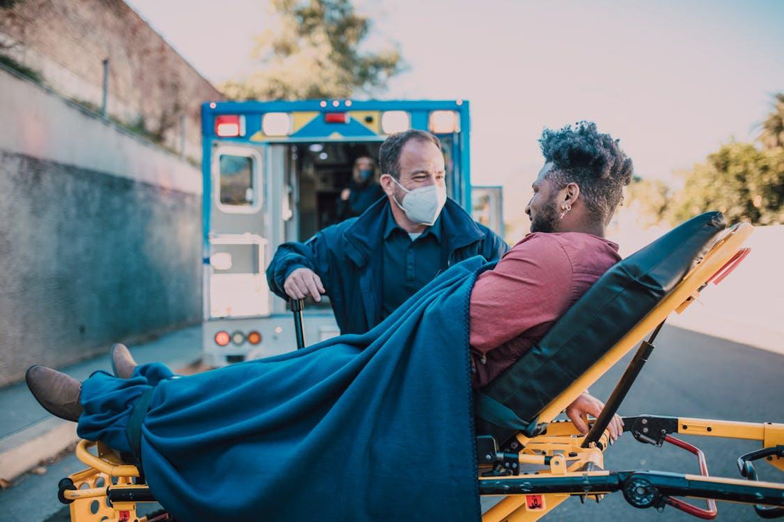 Paramedic rescuing an injured man on a stretcher during an emergency response