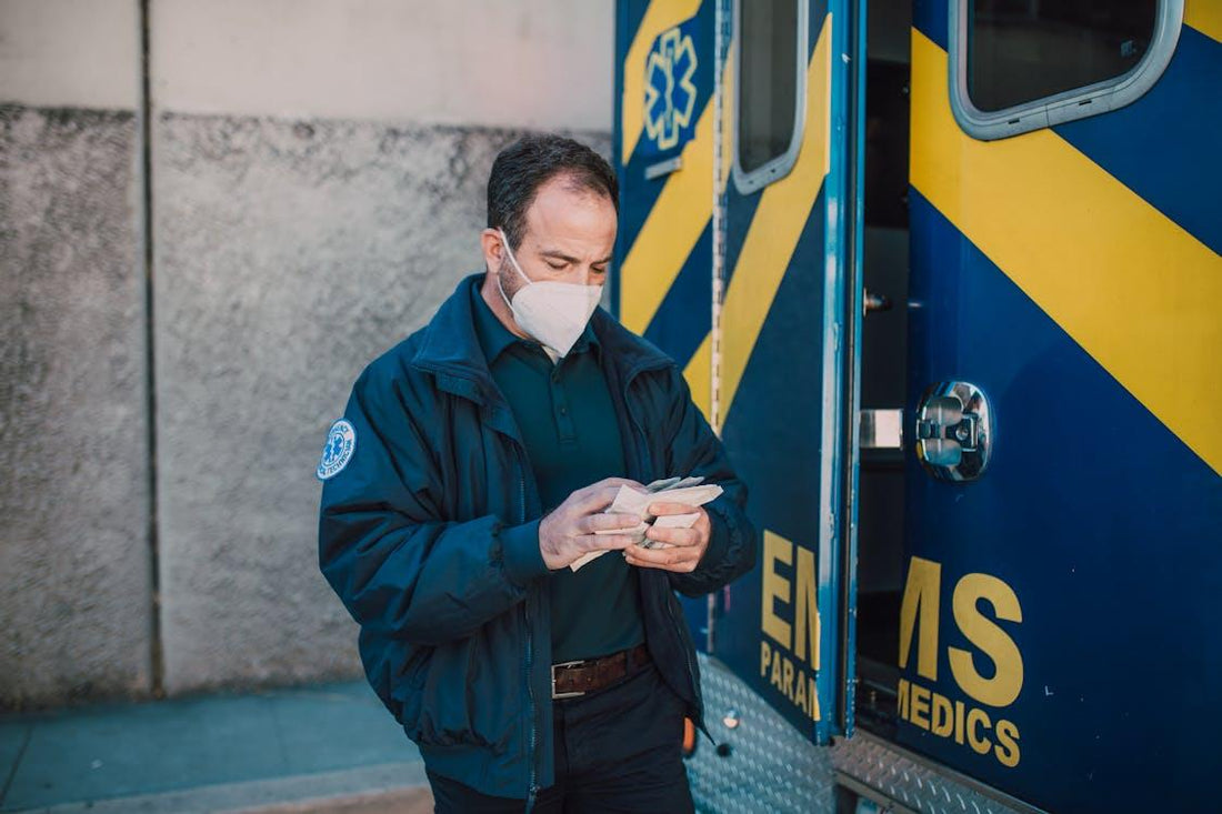 Paramedic wearing a protective face mask while standing in uniform, ready for emergency response duties