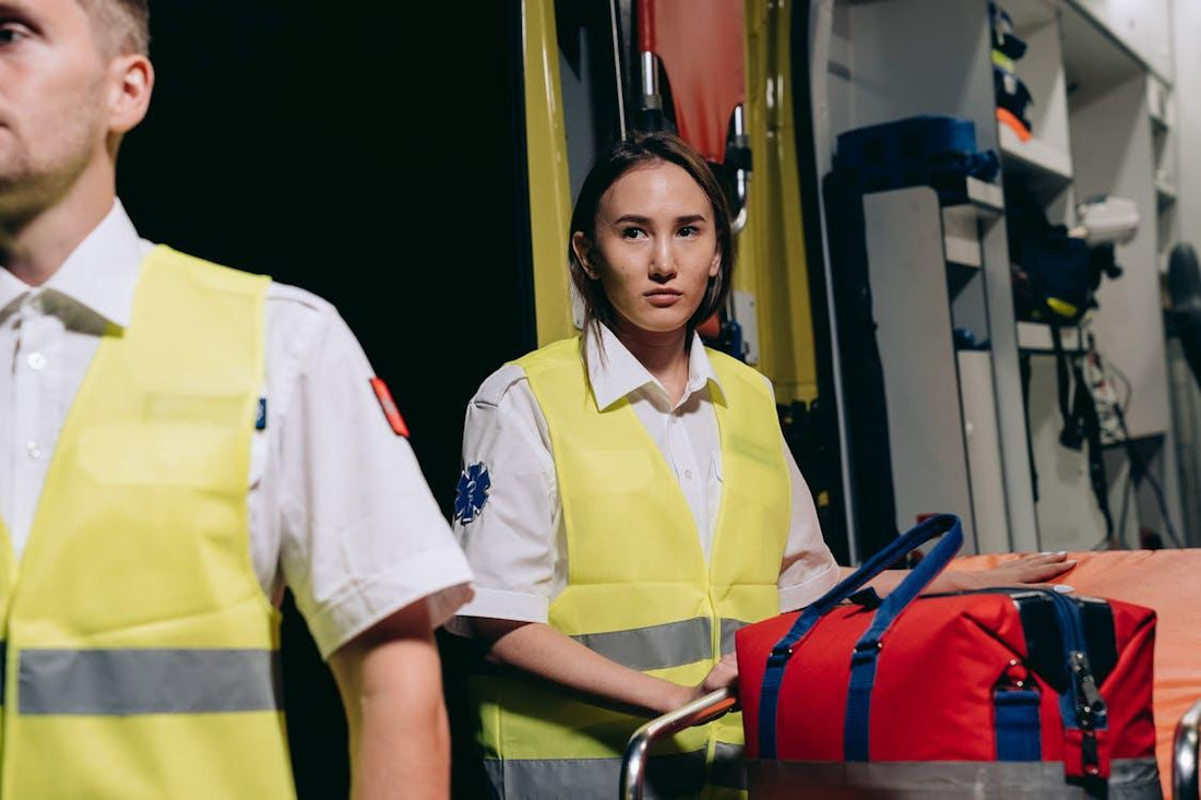 Paramedics wearing reflective vests assisting during an emergency response for the NREMT exam preparation theme