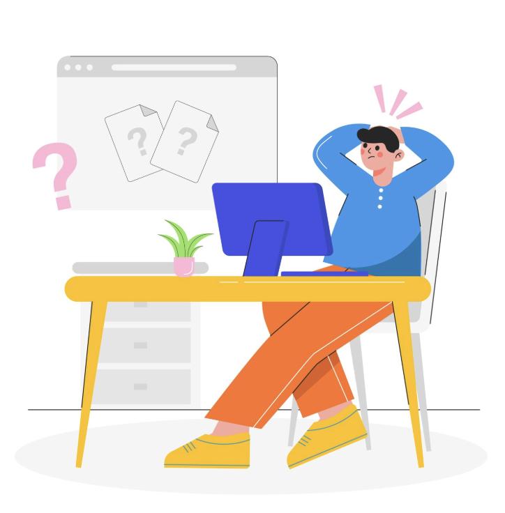 A student sitting at a desk, looking overwhelmed