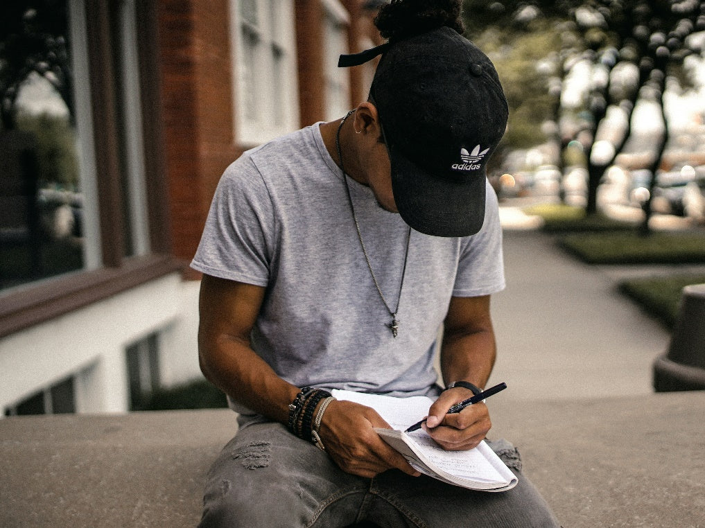 A student writing in a book.