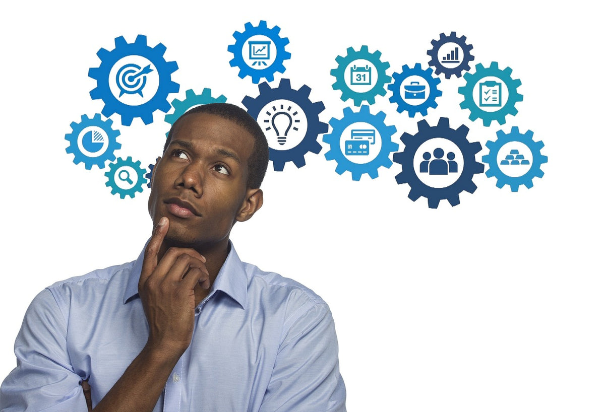 A man thinking with a series of interconnected gears featuring various icons around him