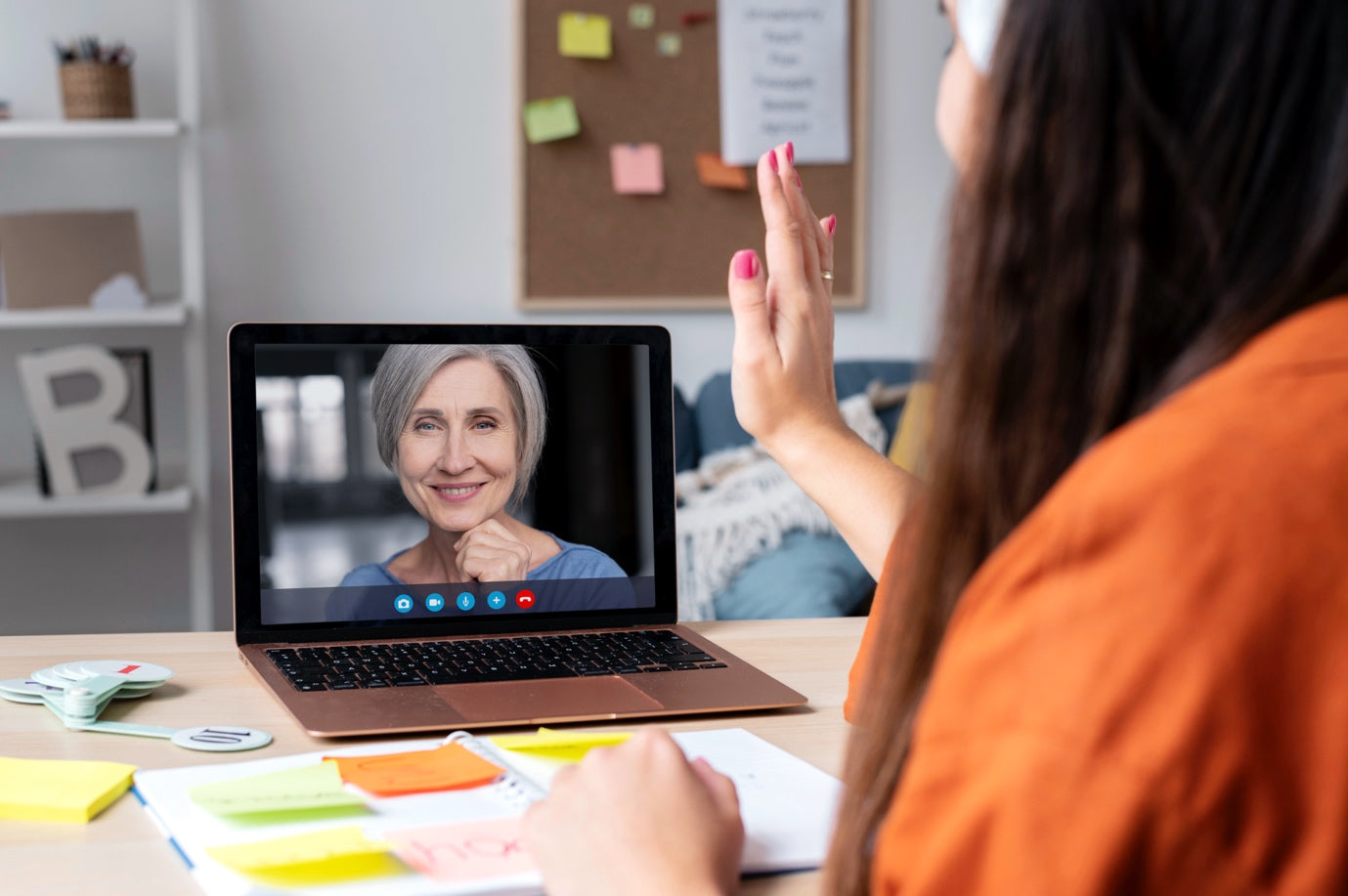 A woman engaged in a virtual study session with an NREMT prep tutor via Zoom, actively participating in a discussion.